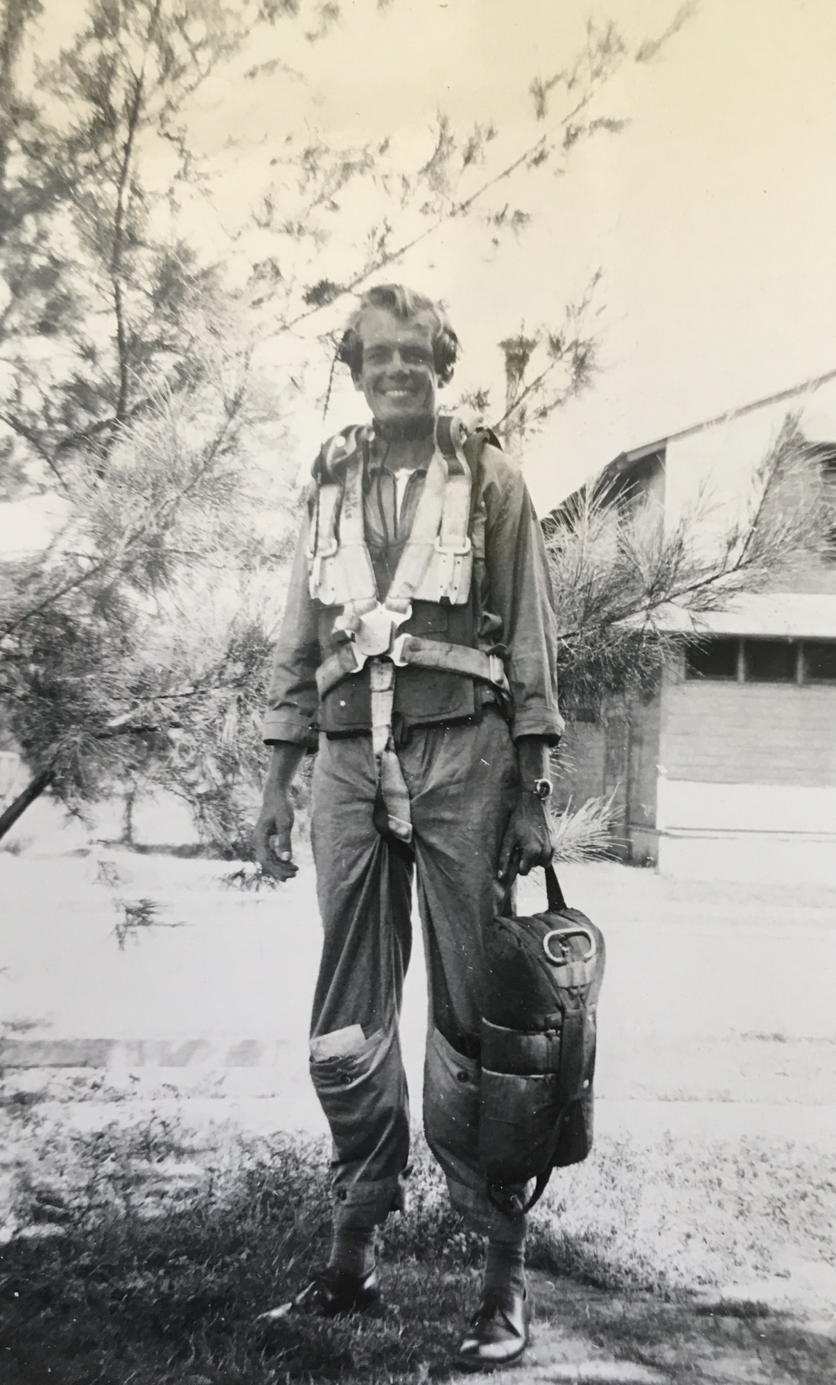 My grandfather in flight gear and parachute harness during World War II